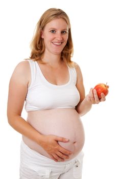 Pregant woman with healthy apple over white background