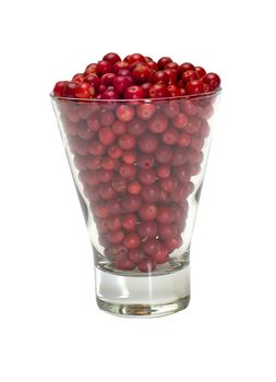 Glass filled with a cowberry isolated on white.