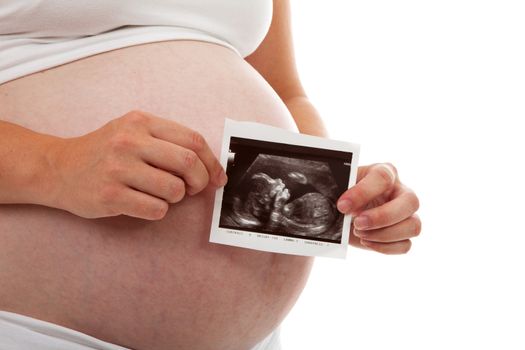 Pregnant mother holding echo over white background
