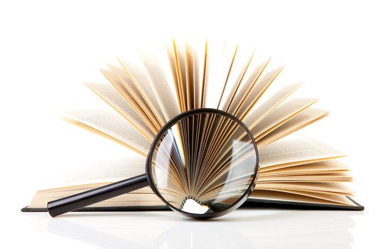 open book with magnifying glass over white background