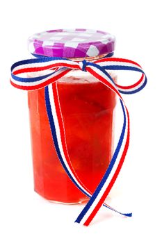 Pot of plums jam over white background