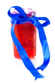 Pot of plums jam over white background