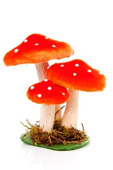 fake red dotted mushroom over white background