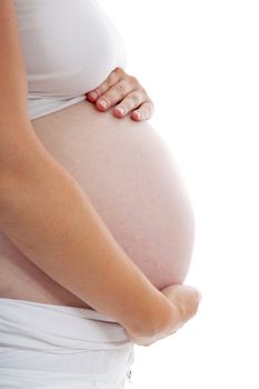 Hands holding pregnant belly over white background
