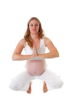 woman doing meditative pregnancy yoga over white background