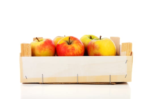 wooden box of apples over white background