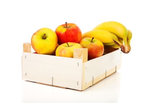 wooden box of apples and bananas over white background