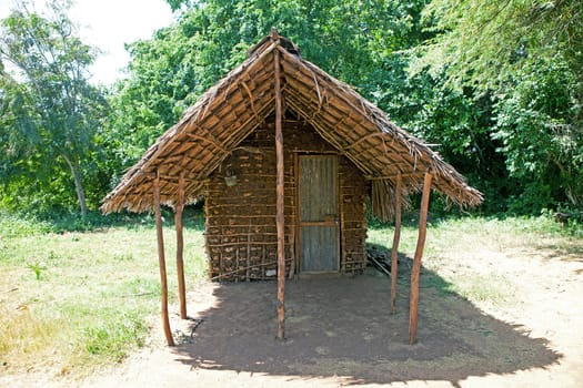 African hut house in village on island Funzi Kenya