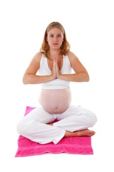 woman doing meditative pregnancy yoga over white background