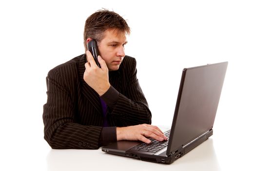 Businessman behind desk is calling over white background
