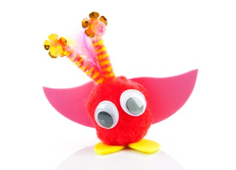 Colorful toy made by child over white background