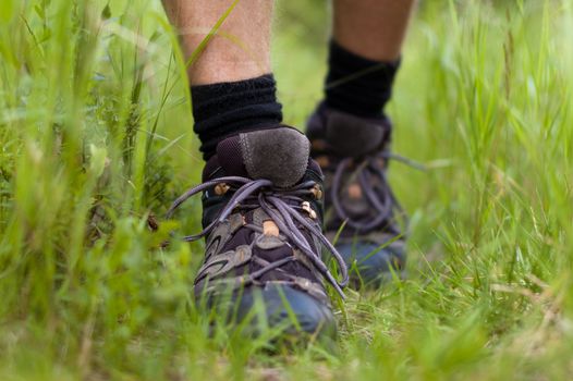 Closeup of a hiking boots in a grass