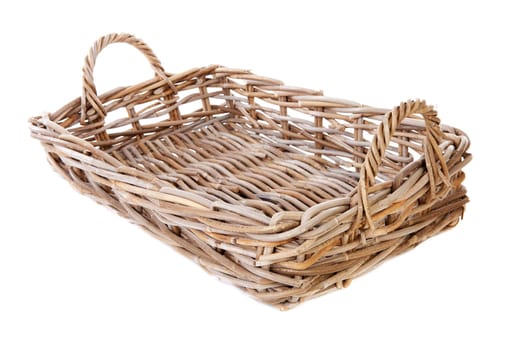 Big empty cane basket over white background