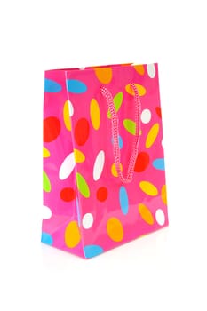 gift bag with dotted print over white background 
