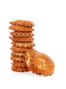 Pile of typical Dutch filled gingerbread cookies over white background