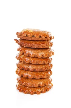 Pile of typical Dutch filled gingerbread cookies over white background