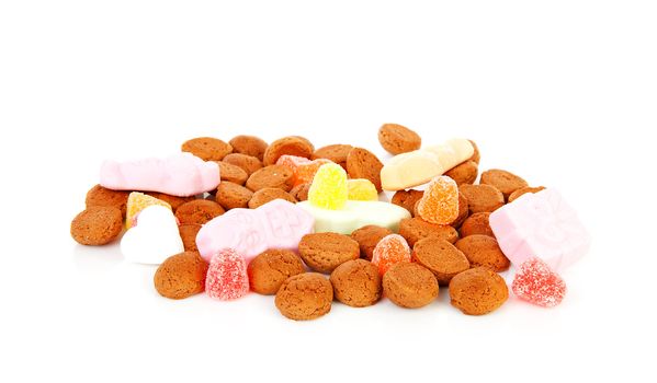 typical Dutch sweets: pepernoten (ginger nuts) for a celebration at 5 december in the Netherlands over white background
