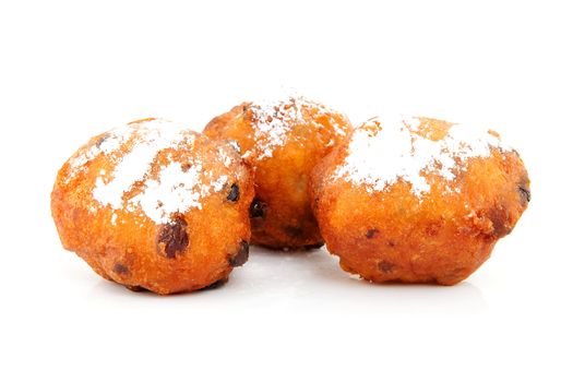 Three Dutch donut also known as oliebollen, traditional New Year's eve food isolated on white background