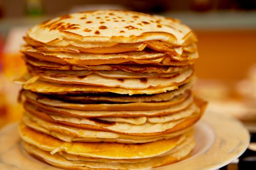 Pile of delicious baked Dutch pancakes in closeup