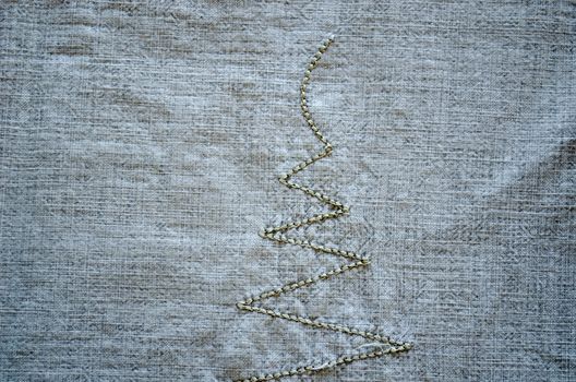 linen shirt background with thread embroider ornament closeup.
