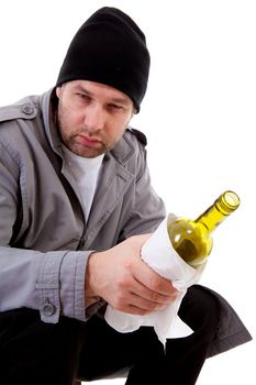 male homeless tramp with empty bottle over white background