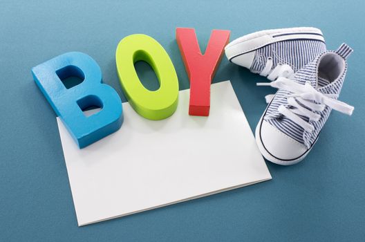 congratulations with a boy card with small sport shoes