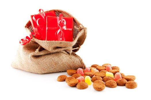 Typical Dutch celebration: Sinterklaas with surprises in bag and ginger nuts, ready for the kids in december. Isolated on white background