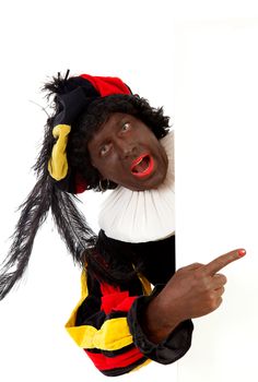 Zwarte piet ( black pete) typical Dutch character part of a traditional event celebrating the birthday of Sinterklaas in december over white background with white empty text board