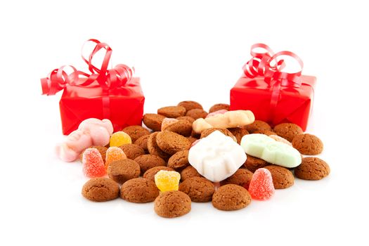 Typical dutch sweets: pepernoten (ginger nuts) and presents for celebration at 5 december in the Netherlands over white background