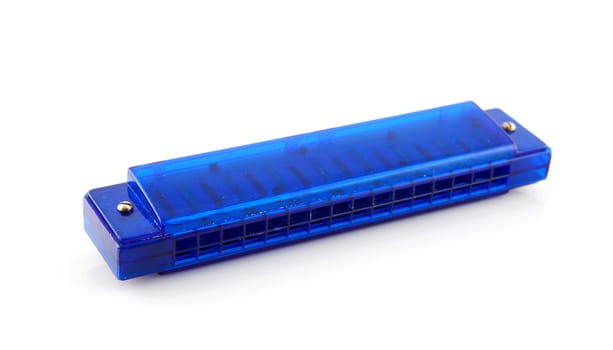 Blue plastic harmonica over white background