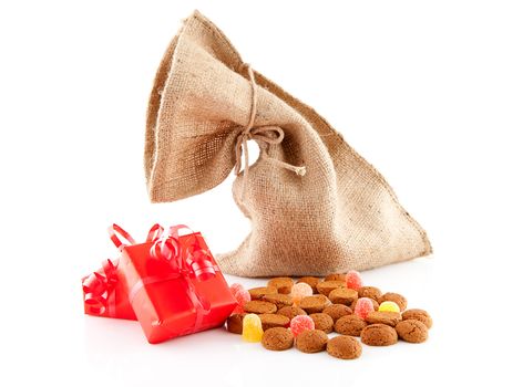 Typical Dutch celebration: Sinterklaas with surprises in bag and ginger nuts, ready for the kids in december. Isolated on white background