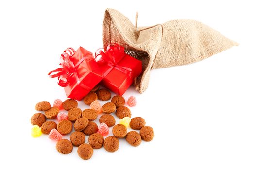 Typical Dutch celebration: Sinterklaas with surprises in bag and ginger nuts, ready for the kids in december. Isolated on white background