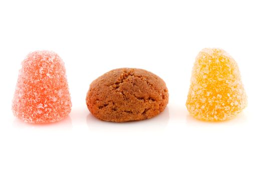 Couple of pepernoten (ginger nuts) and tumtum sweets for typical Dutch festivity at 5 december over white background