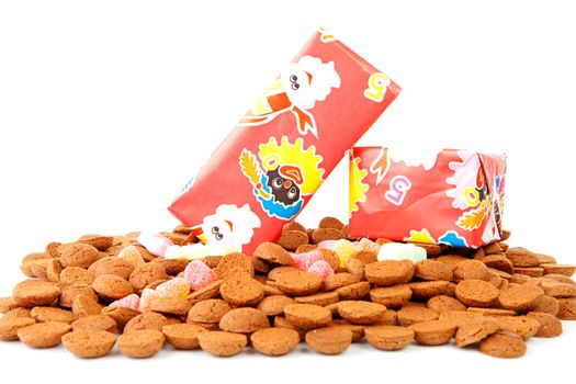 Pepernoten and presents as part of Dutch tradition in december over white background