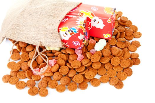 Pepernoten and presents as part of Dutch tradition in december over white background