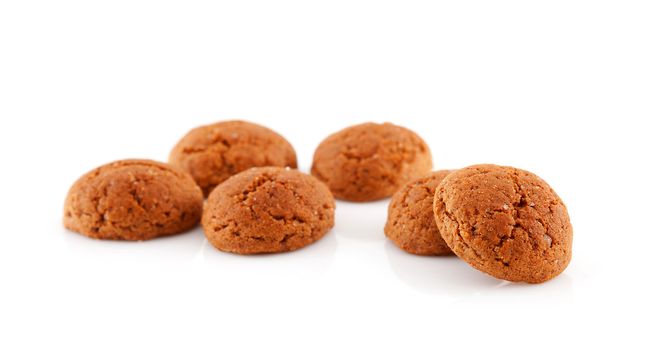 Couple of of pepernoten (ginger nuts) sweets for typical Dutch festivity at 5 december over white background