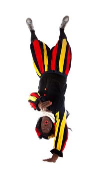 Zwarte piet ( black pete) typical Dutch character part of a traditional event celebrating the birthday of Sinterklaas in december over white background upside down is pointing