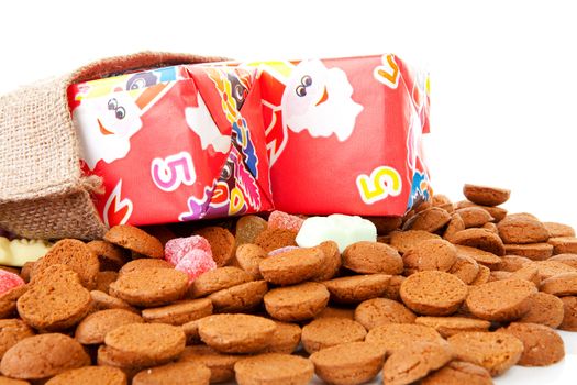 Pepernoten and presents as part of Dutch tradition in december over white background