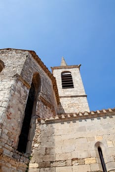 Tower of church in France against blue sky
