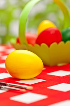 Handcrafted easter eggs with green egg basket