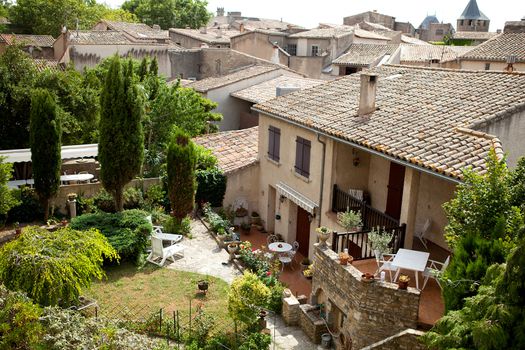 Typical French houses. You see a garden and top of roofs