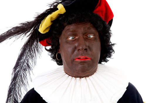 Zwarte piet ( black pete) typical Dutch character part of a traditional event celebrating the birthday of Sinterklaas in december over white background making funny face