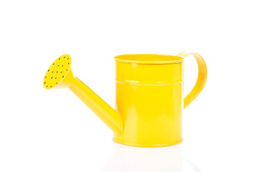 One yellow watering can over white background