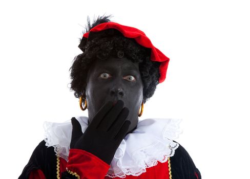 Zwarte piet ( black pete) typical Dutch character part of a traditional event celebrating the birthday of Sinterklaas in december over white background is looking surprised