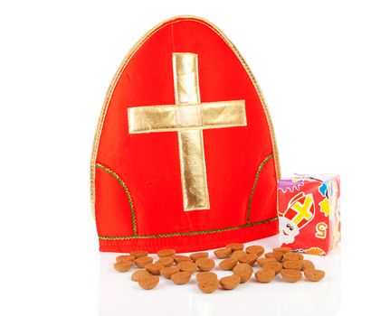Mitre ( mijter) of Sinterklaas and pepernoten ( ginger nuts), typcal Dutch feast in december over white background