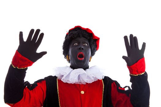 Zwarte piet ( black pete) typical Dutch character part of a traditional event celebrating the birthday of Sinterklaas in december over white background is looking surprised