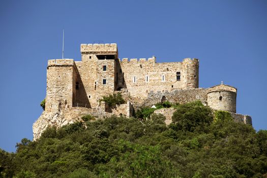 an ancient castle in France on top of mountain