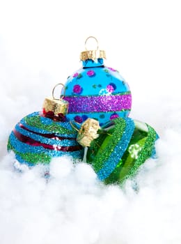 Colorful glitter Christmas balls over white background