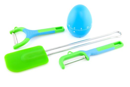  Couple of colorful kitchen utensils over white background