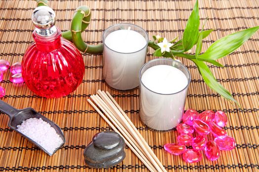 pink spa zen accessories and bamboo on cane mat